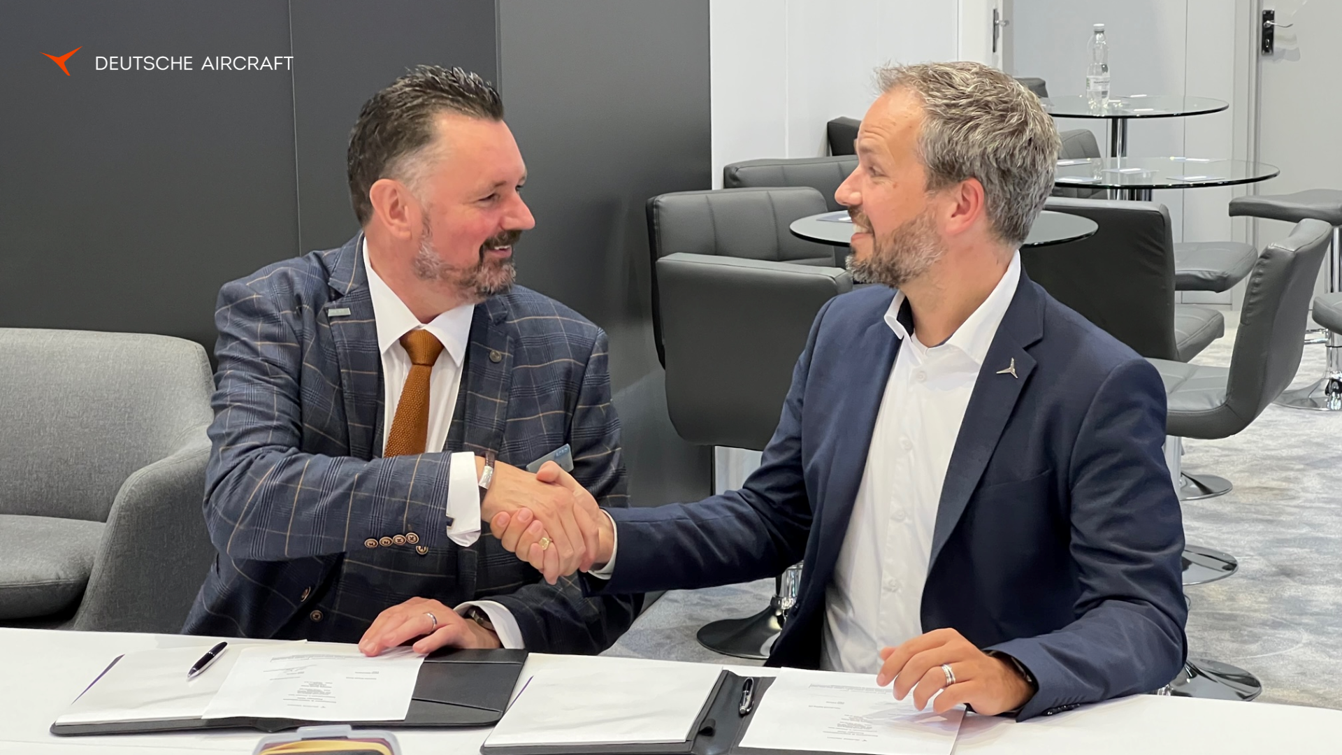 Neil Cairns, Chief Executive of Acro Aircraft Seating (left) and Nico Neumann, COO of Deutsche Aircraft (right) during the signing of the agreement in Hamburg