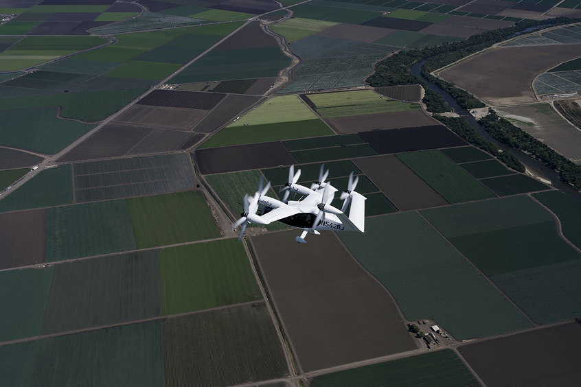 Joby’s all-electric aircraft in flight above Marina, California, the company’s manufacturing and flight test center.