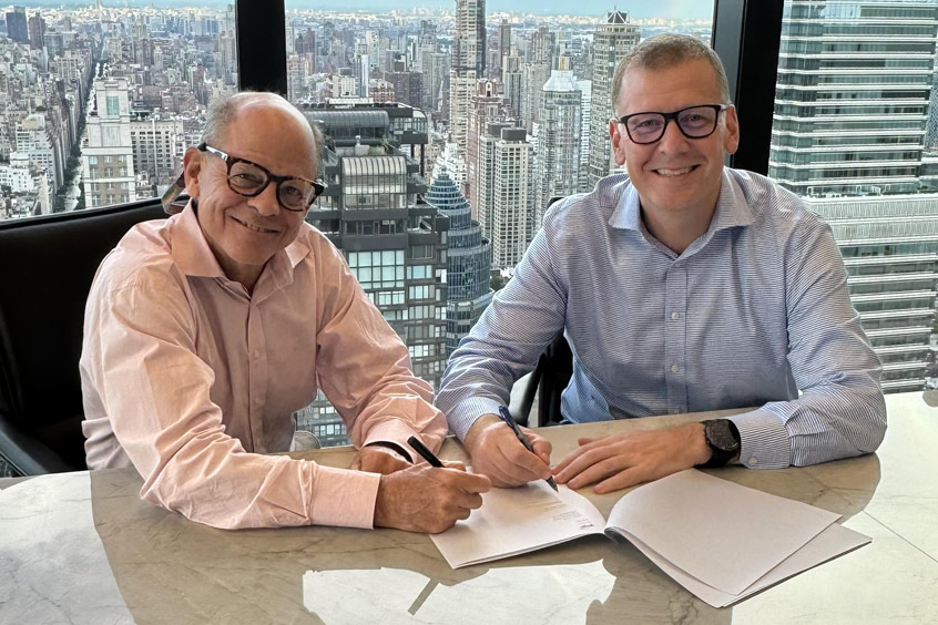 Gogo chairman and CEO Oakleigh Thorne and Satcom Direct president Chris Moore sign the agreement for Gogo to acquire Satcom Direct.