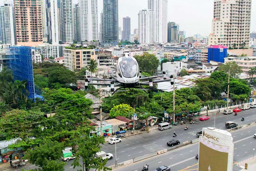 An EH216-S passenger flights over Bangkok, Thailand.